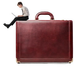 case updates - small person sitting on large briefcase